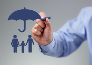 Family cut out under a umbrella in grey blue color drawn by a business man hands